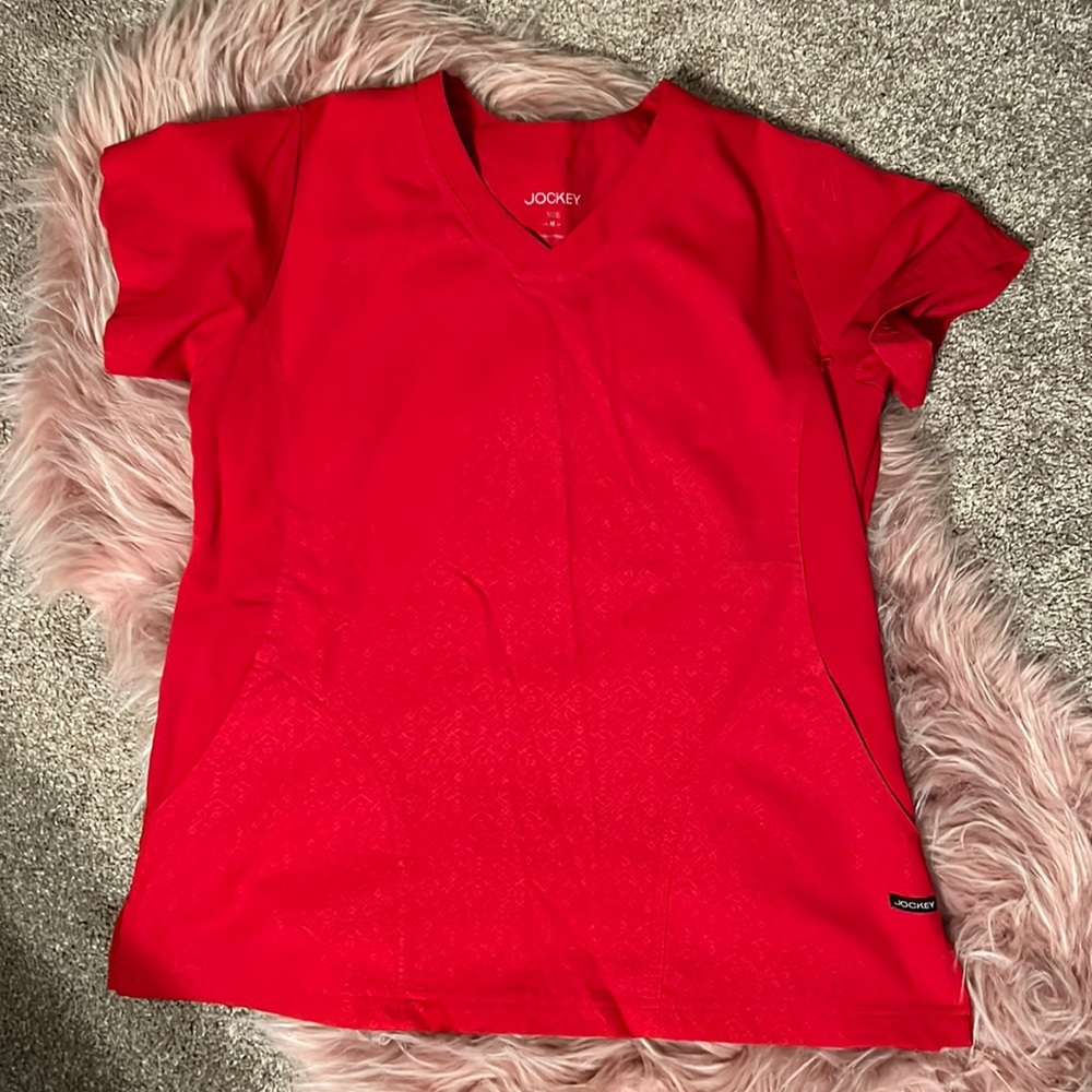 Women’s Jockey red scrub top. Size M.